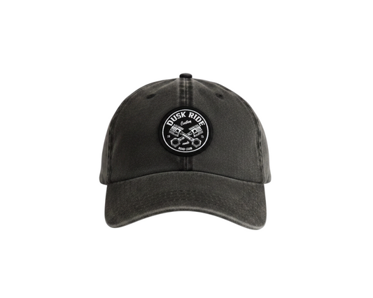Dusk Ride Vintage Cap in verwaschenem Schwarz aus Baumwolle mit rundem Pistons-Patch auf der Vorderseite